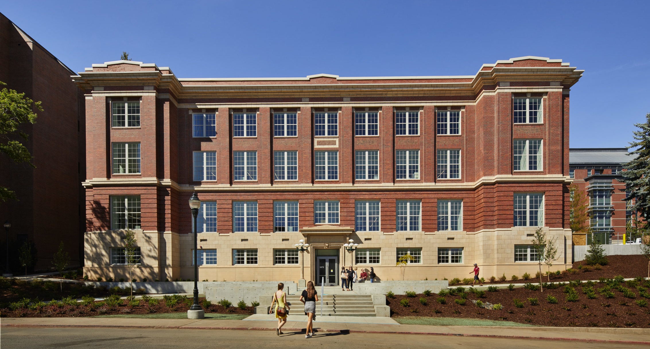 Preserve brick facade of Troy Hall