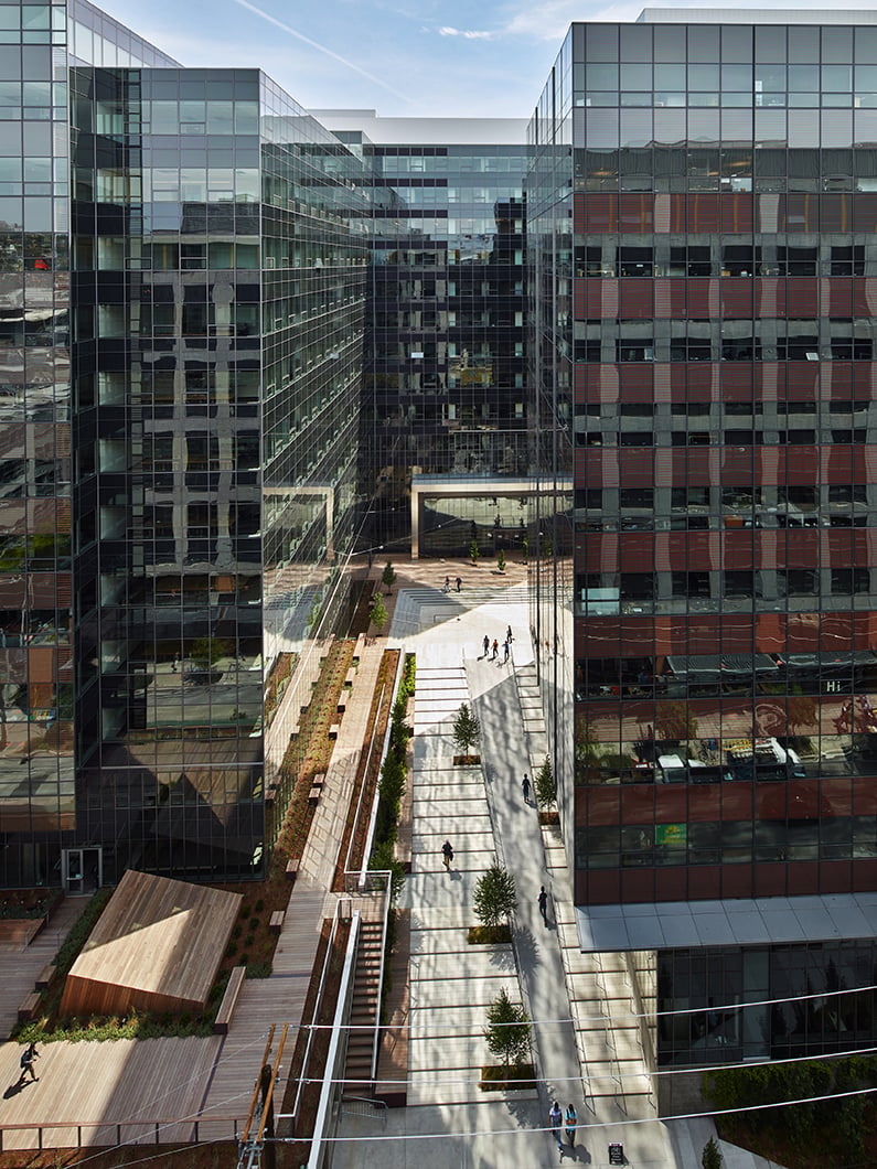 Aerial view of exterior courtyard and roof-deck to the left