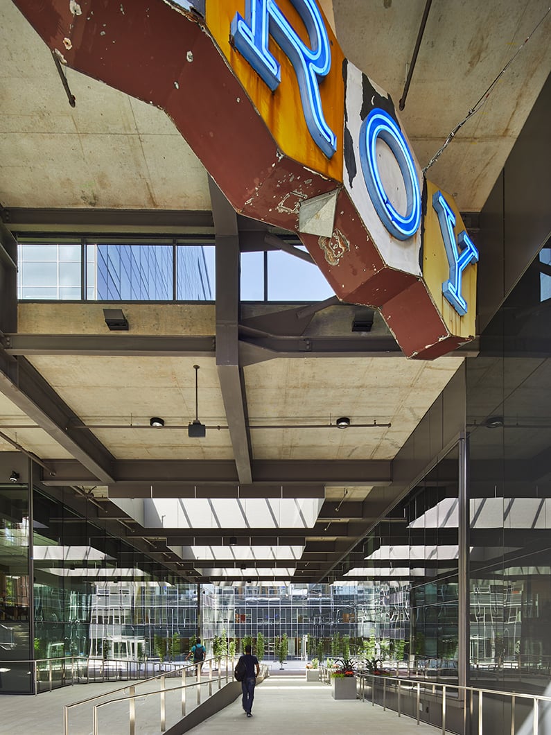 Covered cross-block connection with historic Troy Laundry sign hanging above