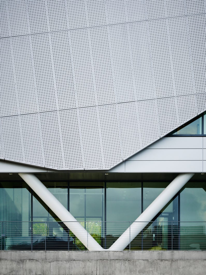 Close-up view of the perforated skin detail on the exterior