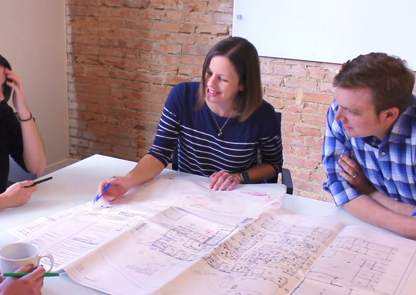 JulieFrazier working with team at the office