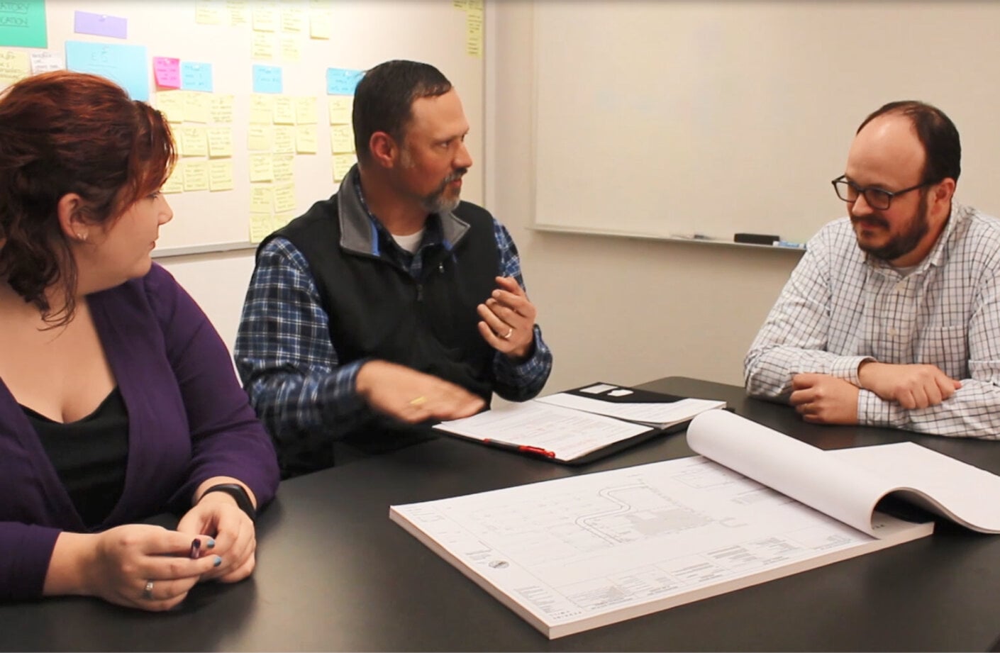 Mark Roan works with team