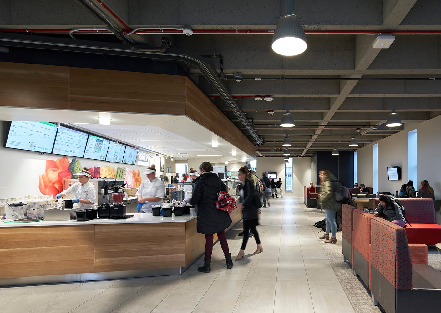 Lounge with soft seating, a cafe, and healthy dining options