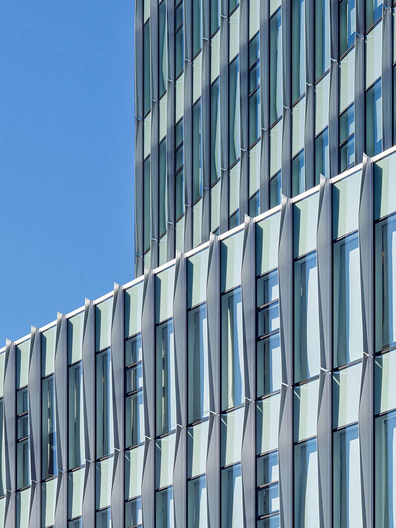 Detail of shading system and stepped form of building.