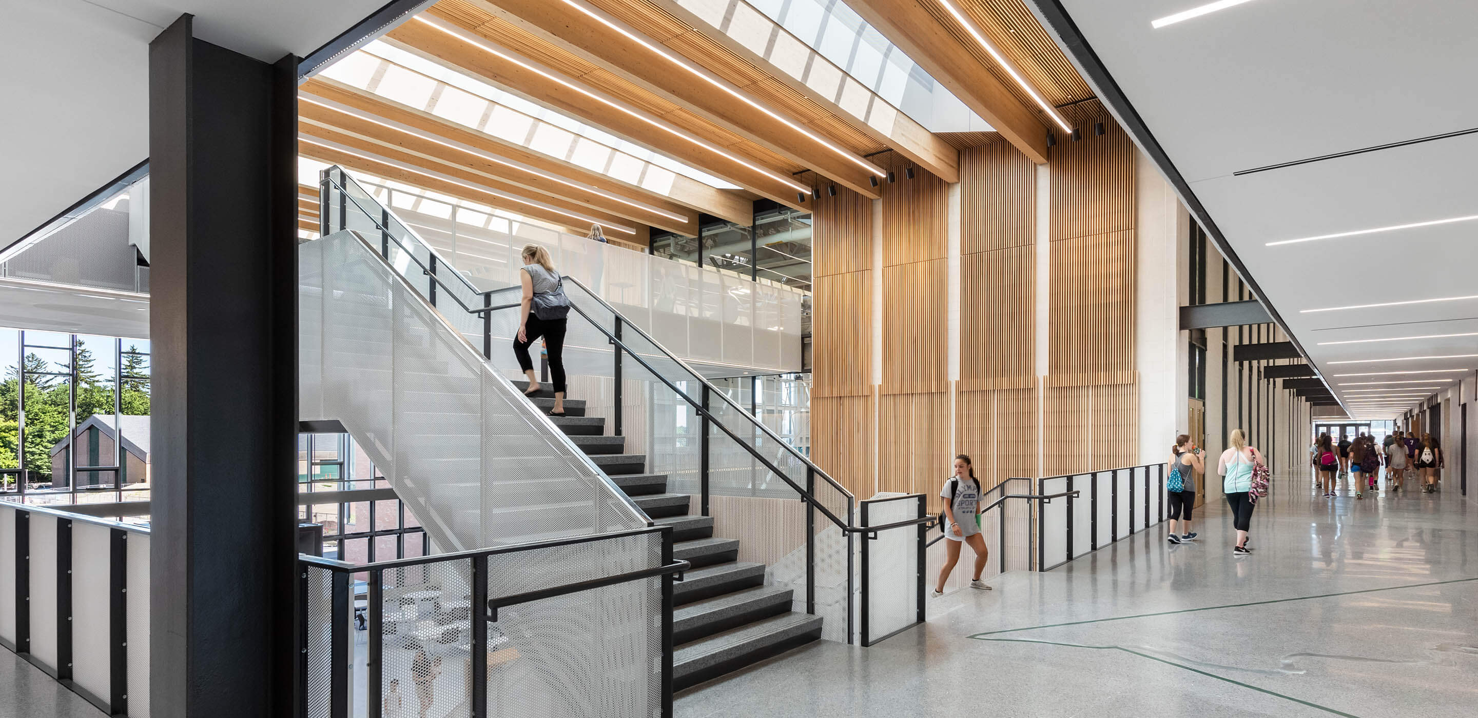 Photo of daylight-filled stairway in a school