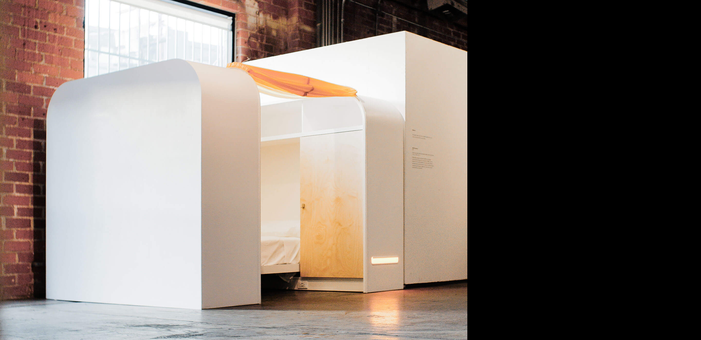 Photo of a modular bed unit designed for homeless shelters