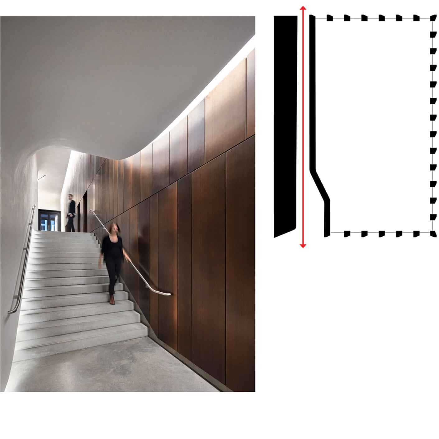 Photo of person walking down stairs to rear entrance of lobby with another individual exiting the elevator in the background.