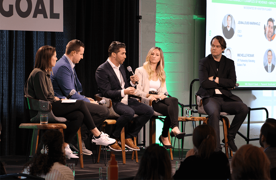 Photo of sports and entertainment industry experts onstage, discussing sustainable operations at arenas and other venues