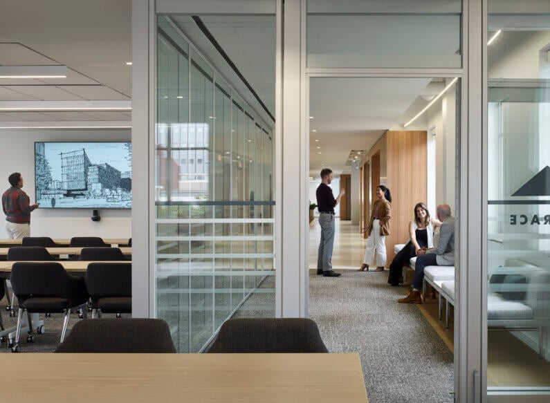 A meeting space with staff members.