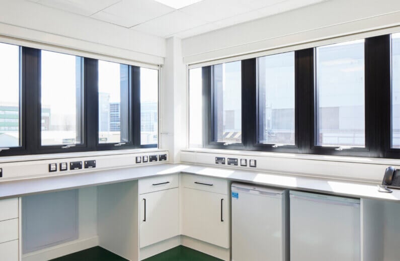 A white ancillary space with windows.