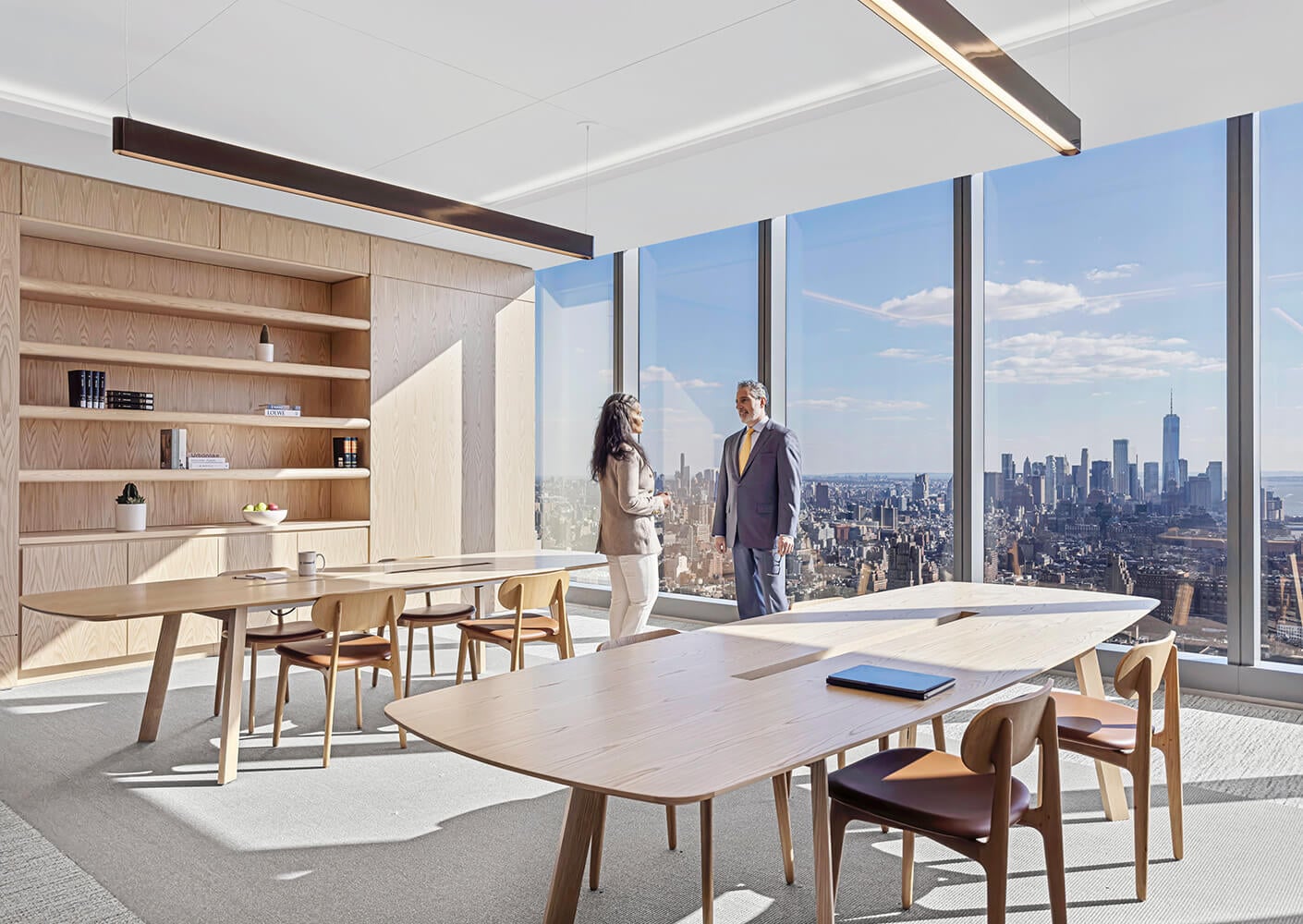 Conference room with employees standing