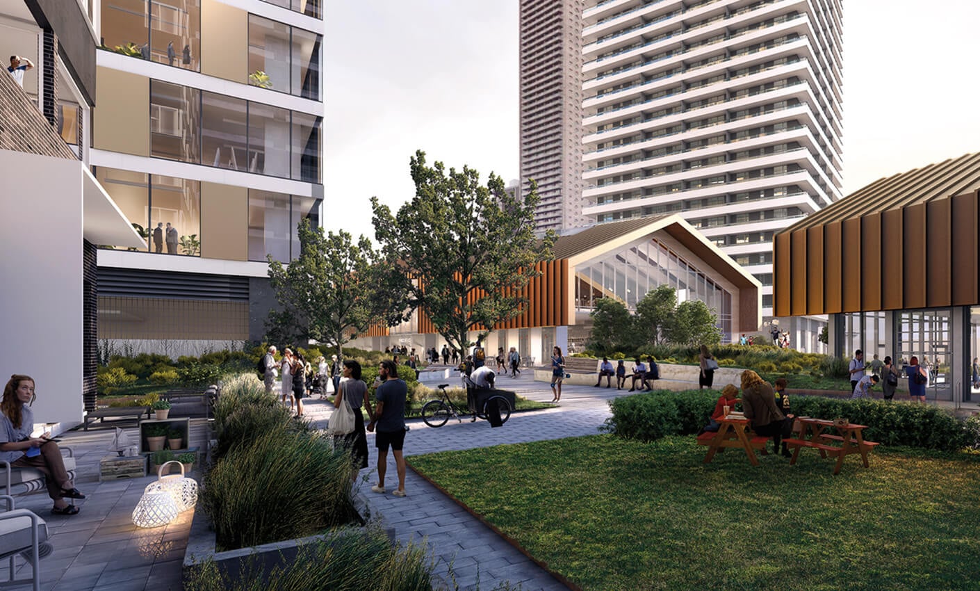 Modern urban courtyard with people relaxing, tall buildings, and greenery, featuring benches and outdoor seating areas.