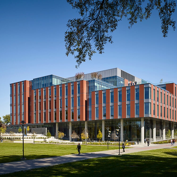 Modern building with glass and brick facade on a clear day.