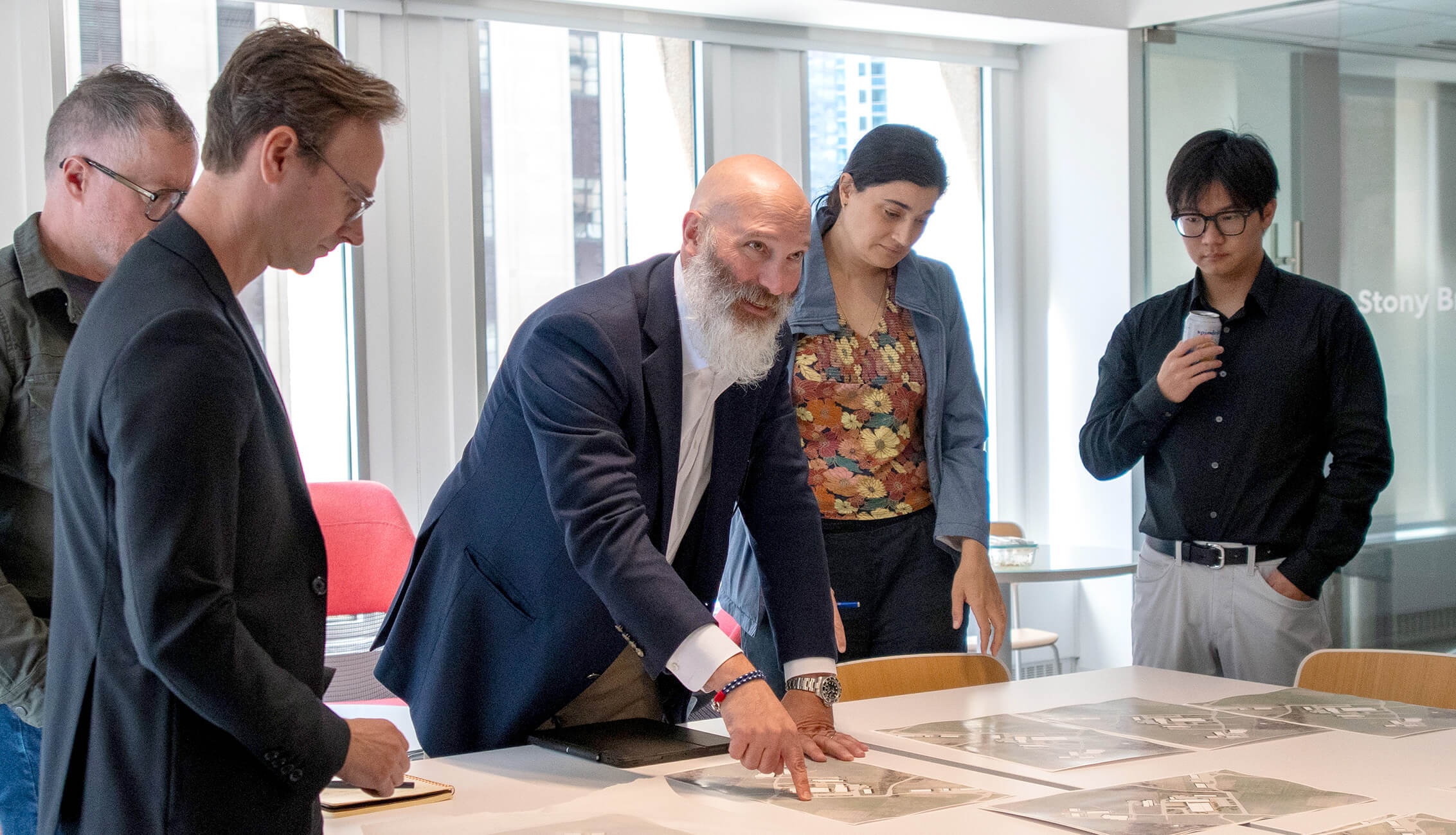 Jeff Zynda reviews aerial site photos with colleagues