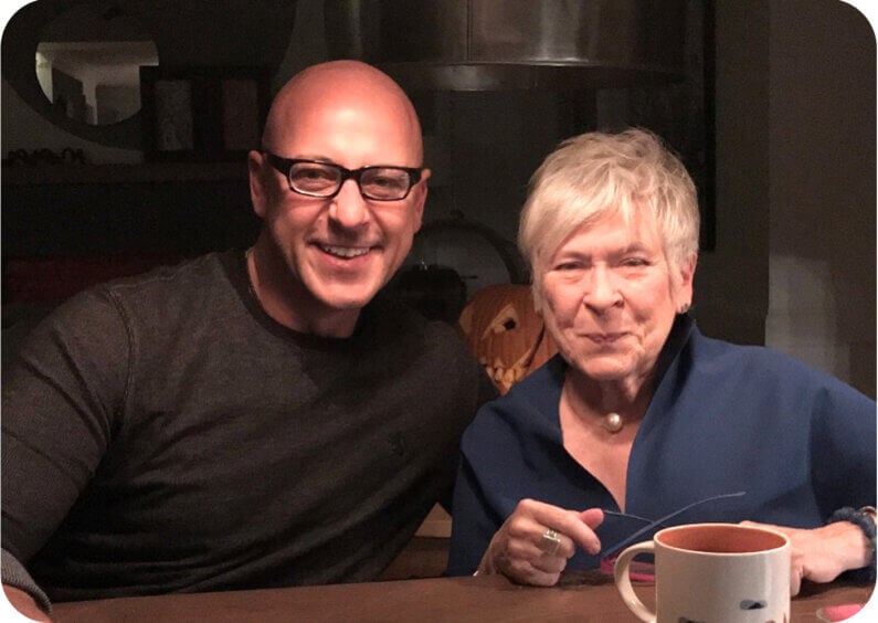 Keith and Eva smiling together at a table