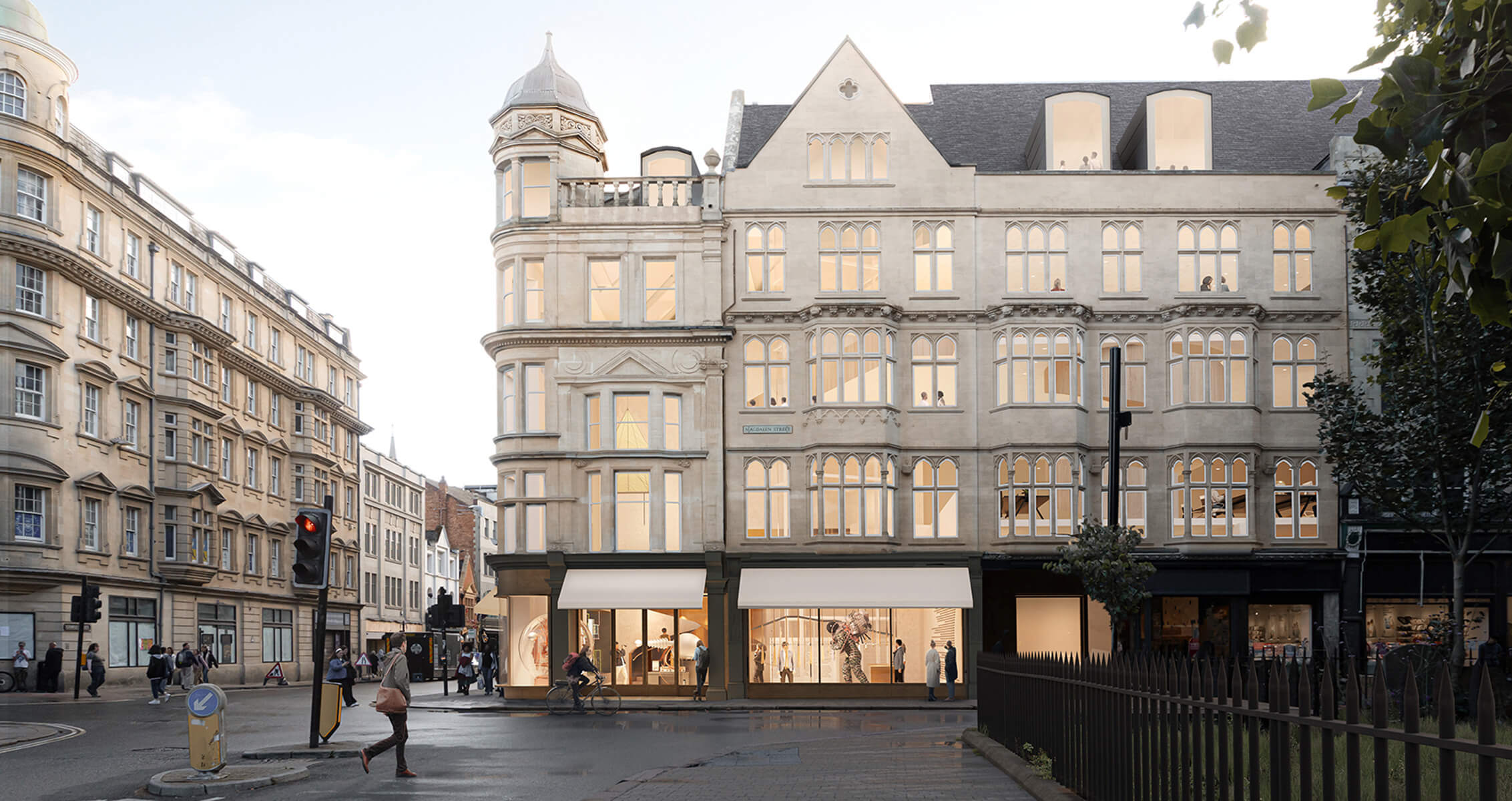 Historic architectural building featuring retail spaces and pedestrians on the street.