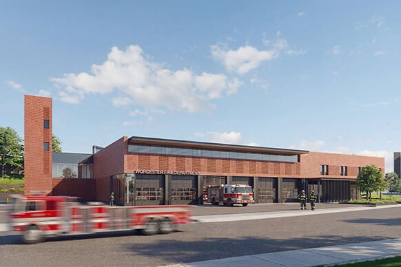 Rendering of the Worcester Fire Department building, featuring red brick architecture, fire trucks, and emergency personnel on site.